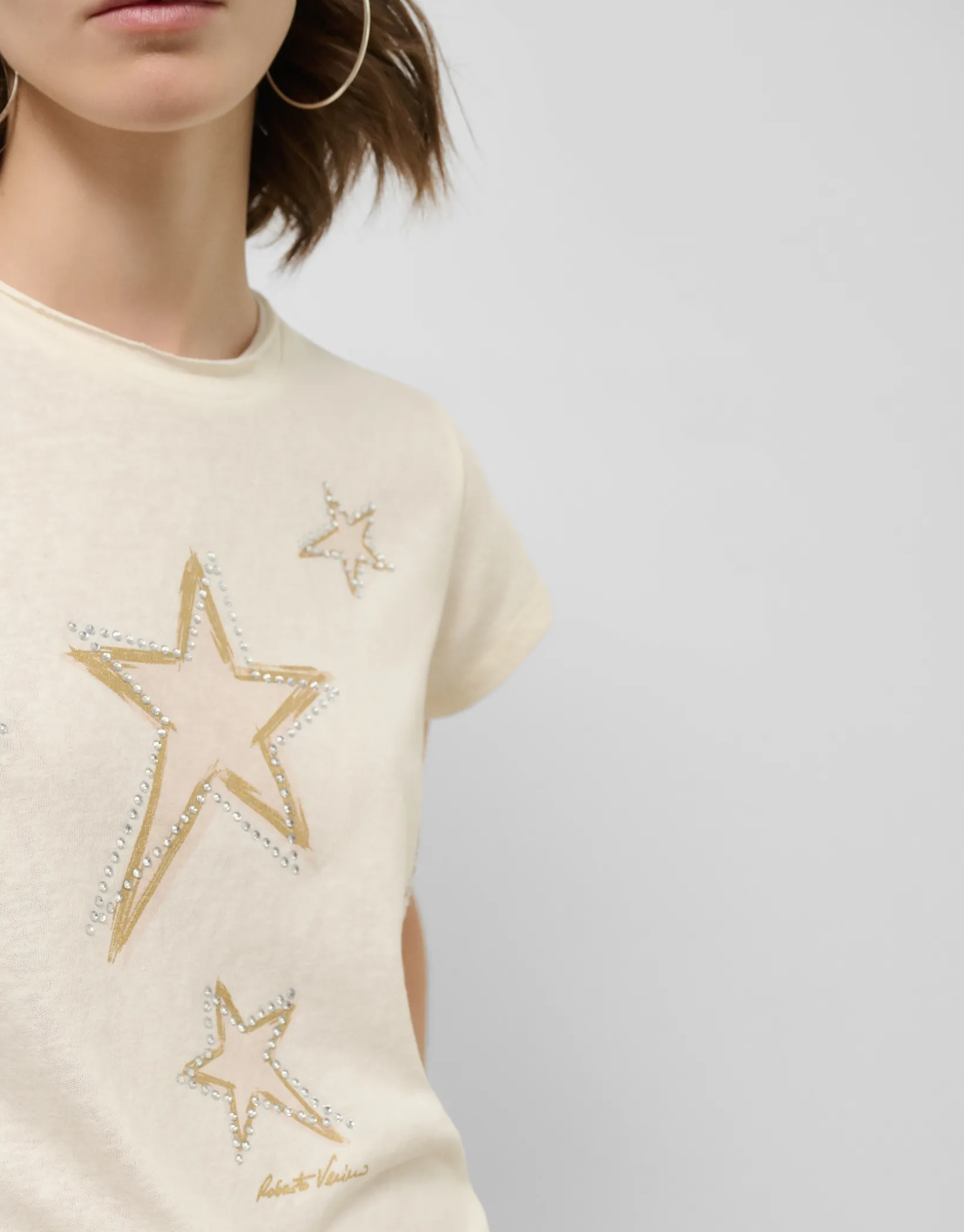 Camiseta punto ligero estampado estrellas doradas