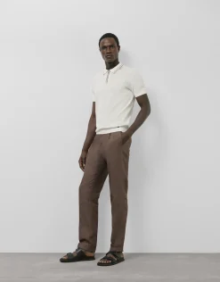Polo tricotado blanco con rayas en cuello y puños