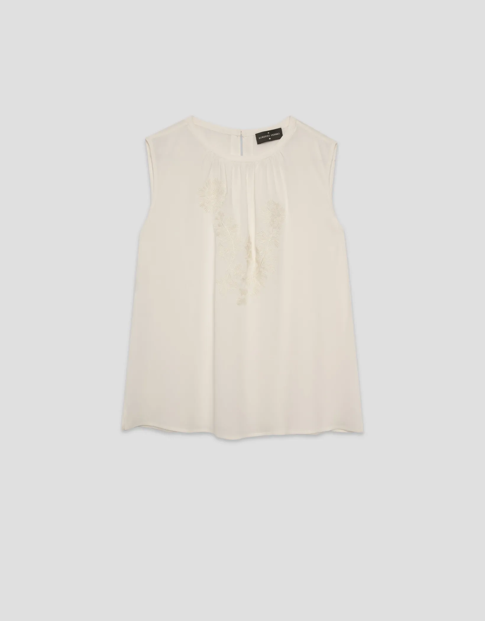 Top tejido fluido beige con bordado floral