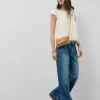 Blusa manga corta blanco roto con mini volantes en delantero