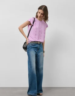 Blusa manga corta rosa con mini volantes en delantero