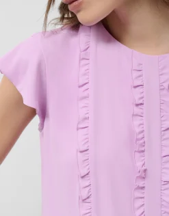 Blusa manga corta rosa con mini volantes en delantero