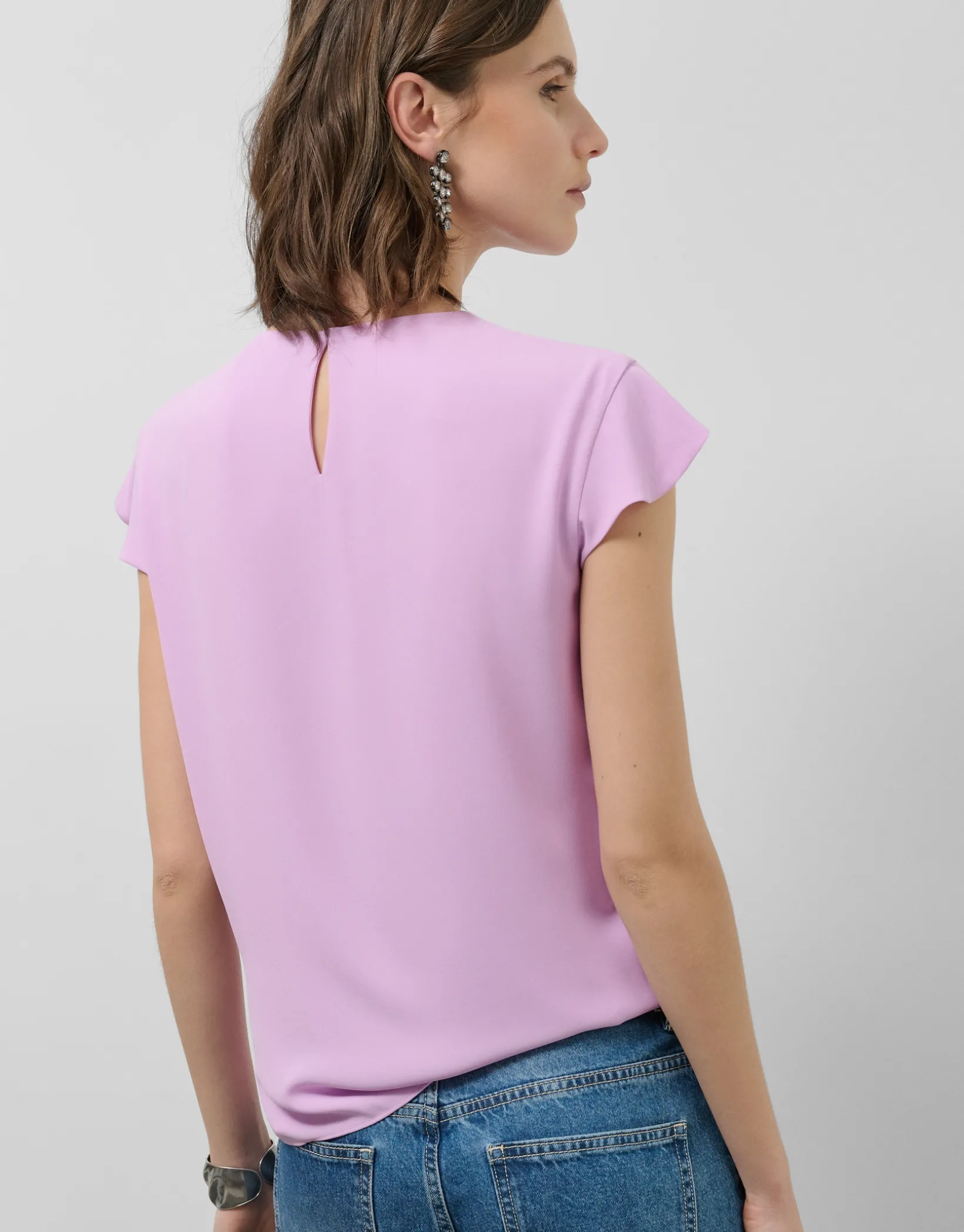 Blusa manga corta rosa con mini volantes en delantero