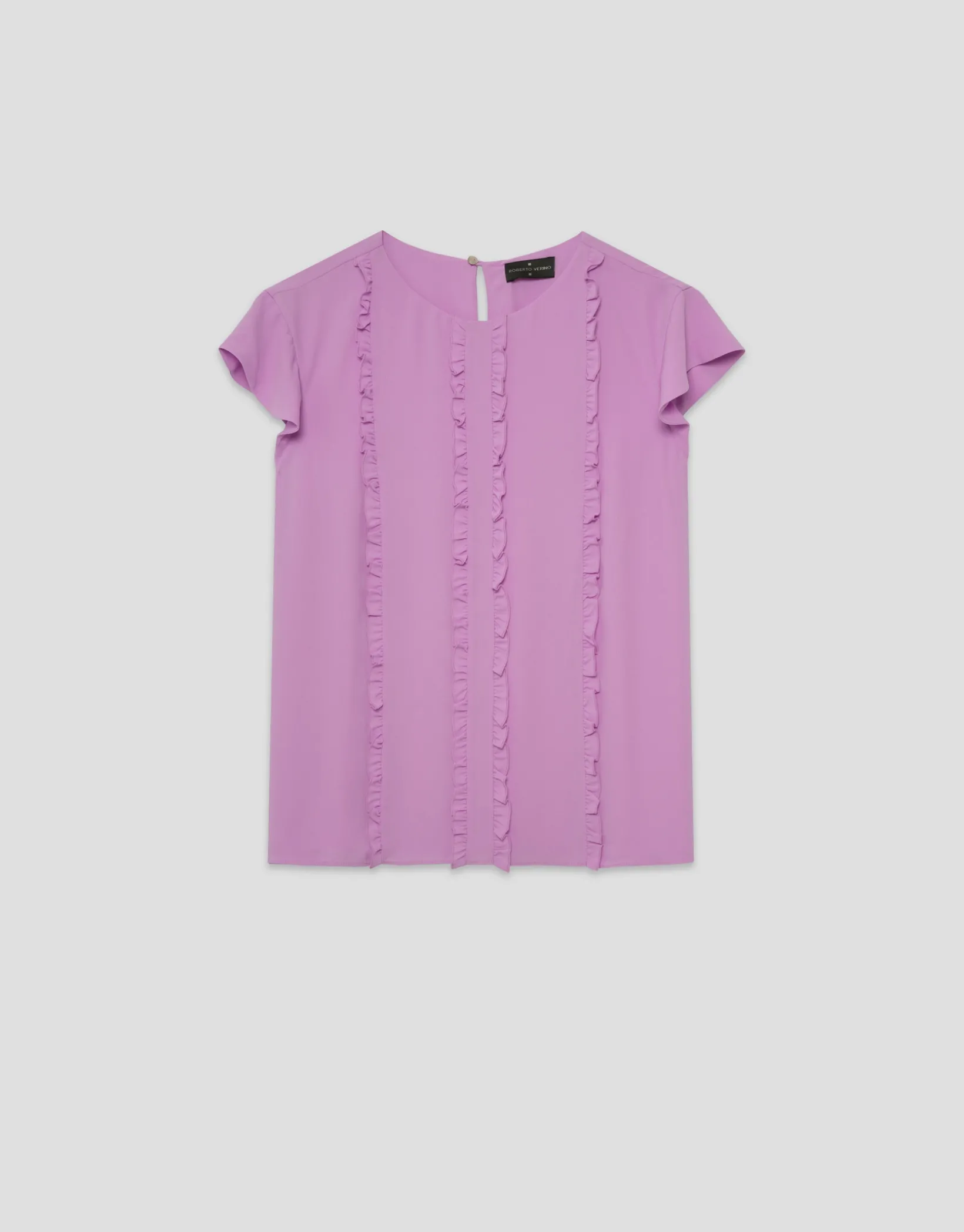 Blusa manga corta rosa con mini volantes en delantero