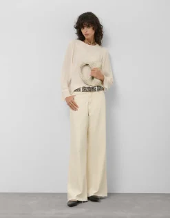 Blusa manga larga tejido fluido beige con bordado floral