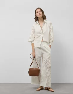Blusa oversize con diseño floral en devoré crudo