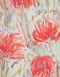 Blusón en gasa estampado vegetal floral tonos coral y rojo