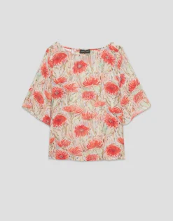 Blusón en gasa estampado vegetal floral tonos coral y rojo