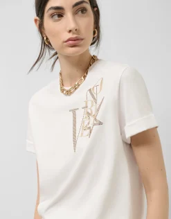 Camiseta oversize algodón blanco logo brillo dorado