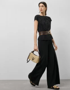 Camiseta sin mangas oversize negra con bordado en delantero