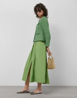 Falda larga en tafeta verde con abertura delantera