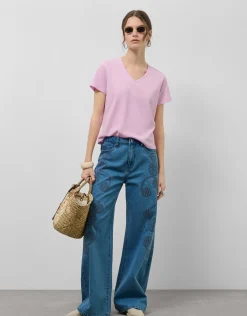 Pantalón vaquero ancho azul con bordados florales