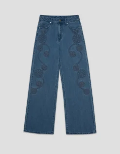 Pantalón vaquero ancho azul con bordados florales