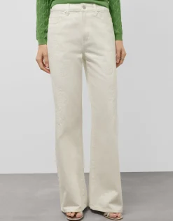 Pantalón vaquero ancho beige con bordados florales