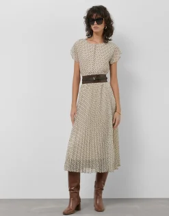 Vestido midi falda plisada estampado geométrico blanco y negro