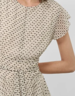 Vestido midi falda plisada estampado geométrico blanco y negro